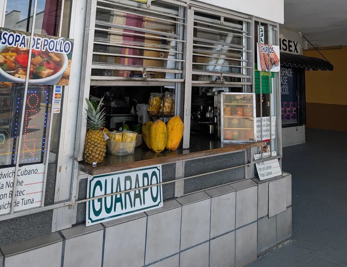 Fresh pineapples and papayas on the counter